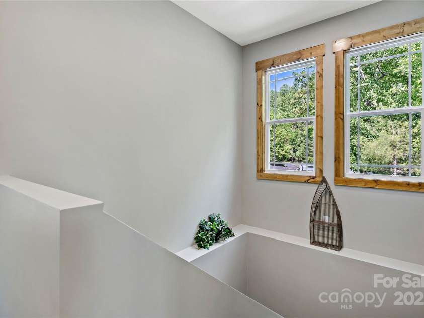 23 Laurel Crest Lane, Mill Spring, NC 28756.  MLS# CAR4294698, YatesRealty ID 34956. Stairs leading to finished basement