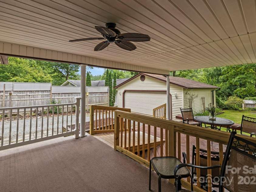 105 Corn Drive, Cedar Mountain, NC 28718.  MLS# CAR4289509, YatesRealty ID 3497. Covered front porch and entertaining deck
