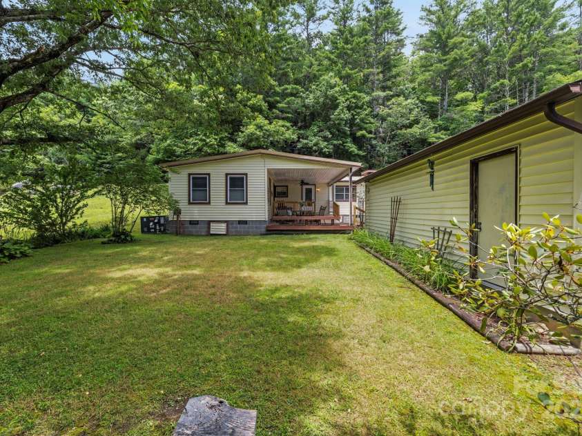 105 Corn Drive, Cedar Mountain, NC 28718.  MLS# CAR4289509, YatesRealty ID 3497. Fire pit in back yard