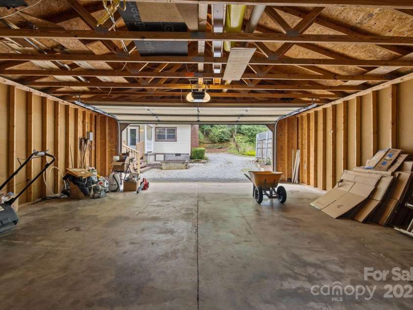 105 Corn Drive, Cedar Mountain, NC 28718.  MLS# CAR4289509, YatesRealty ID 3497. Garage space for workbench