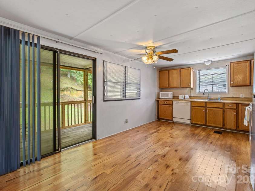 105 Corn Drive, Cedar Mountain, NC 28718.  MLS# CAR4289509, YatesRealty ID 3497. Kitchen view to back porch