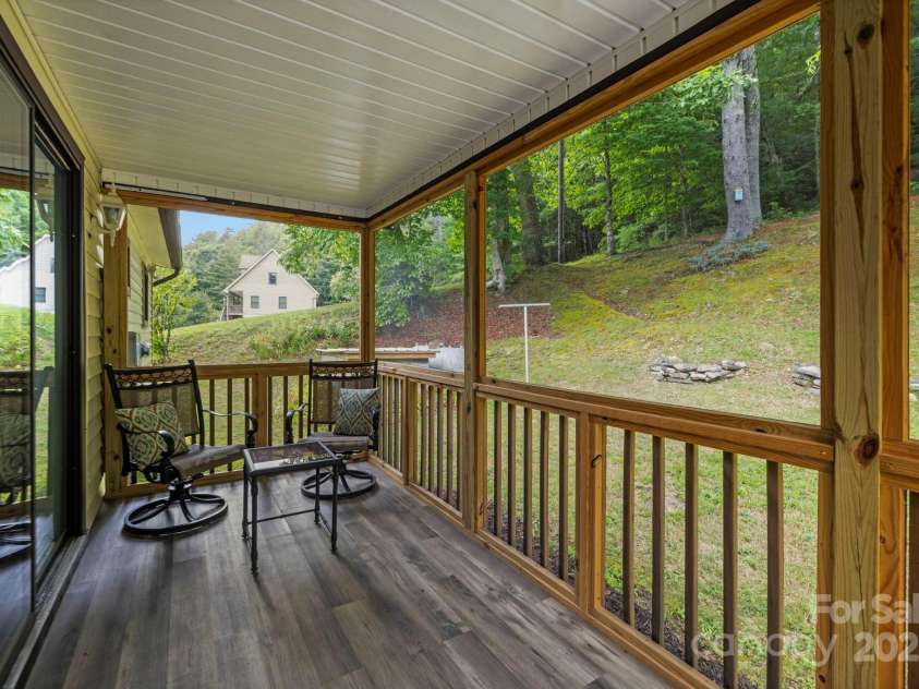 105 Corn Drive, Cedar Mountain, NC 28718.  MLS# CAR4289509, YatesRealty ID 3497. Screen porch 