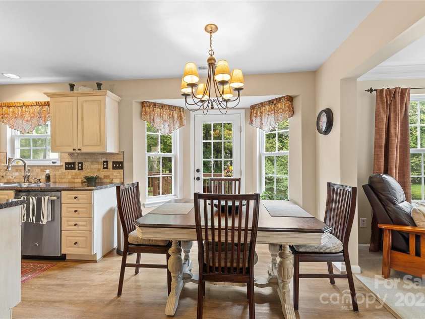 3121 Spring Fancy Lane, Indian Trail, NC 28079.  MLS# CAR4289656, YatesRealty ID 34973. Bay kitchen opens to expansive back deck