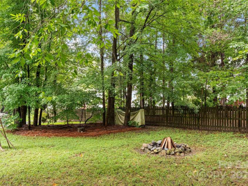 3121 Spring Fancy Lane, Indian Trail, NC 28079.  MLS# CAR4289656, YatesRealty ID 34973. On other side of bridge/creek - lots of usable space