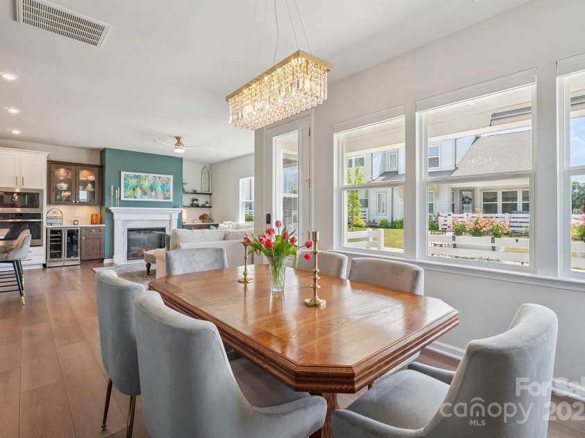 3161 Baines Court, Kannapolis, NC 28081.  MLS# CAR4283103, YatesRealty ID 34980. Beautiful Dining Area with accent wall, custom chandelier, LVP flooring & plenty of windows for perfect natural light!