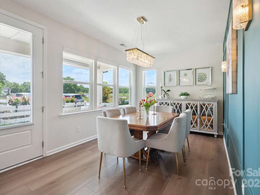 3161 Baines Court, Kannapolis, NC 28081.  MLS# CAR4283103, YatesRealty ID 34980. Beautiful Dining Area with accent wall, custom chandelier, LVP flooring & plenty of windows for perfect natural light!