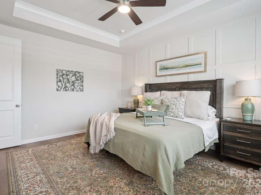 3161 Baines Court, Kannapolis, NC 28081.  MLS# CAR4283103, YatesRealty ID 34980. Gorgeous, Spacious Primary Suite on main level with tray ceiling, crown molding, accent wall, plantation shutters, ceiling fan/light, LVP floors, private bath & walk in closet!