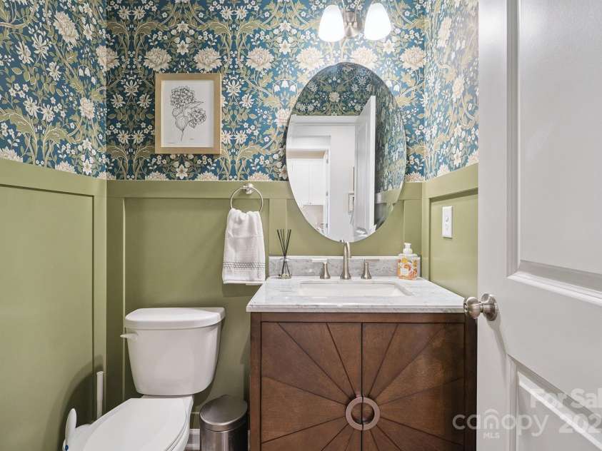 3161 Baines Court, Kannapolis, NC 28081.  MLS# CAR4283103, YatesRealty ID 34980. Half Bath on main level with accent wall/stunning wall paper & custom vanity!