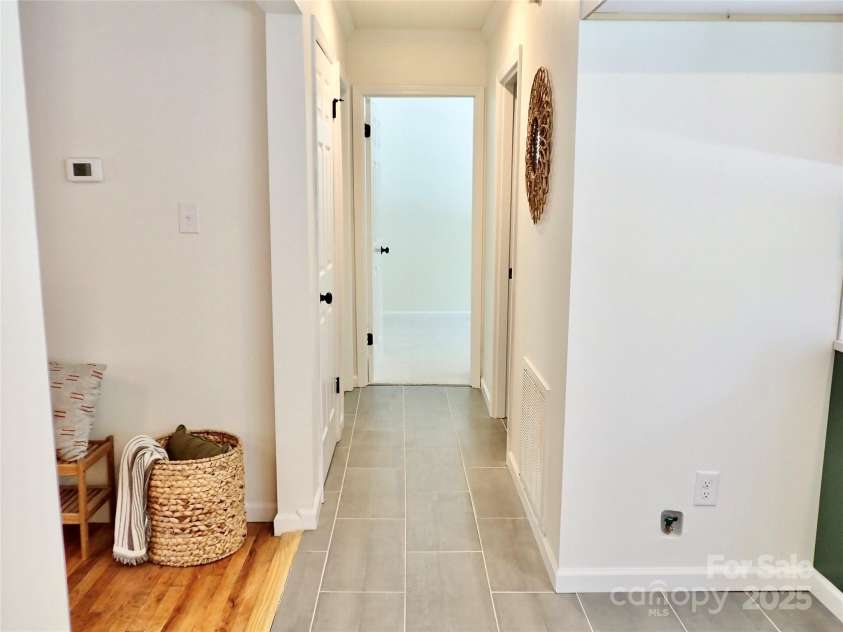 3921 Lake Road, Charlotte, NC 28269.  MLS# CAR4272697, YatesRealty ID 34981. Hall way to full bath and two bedrooms