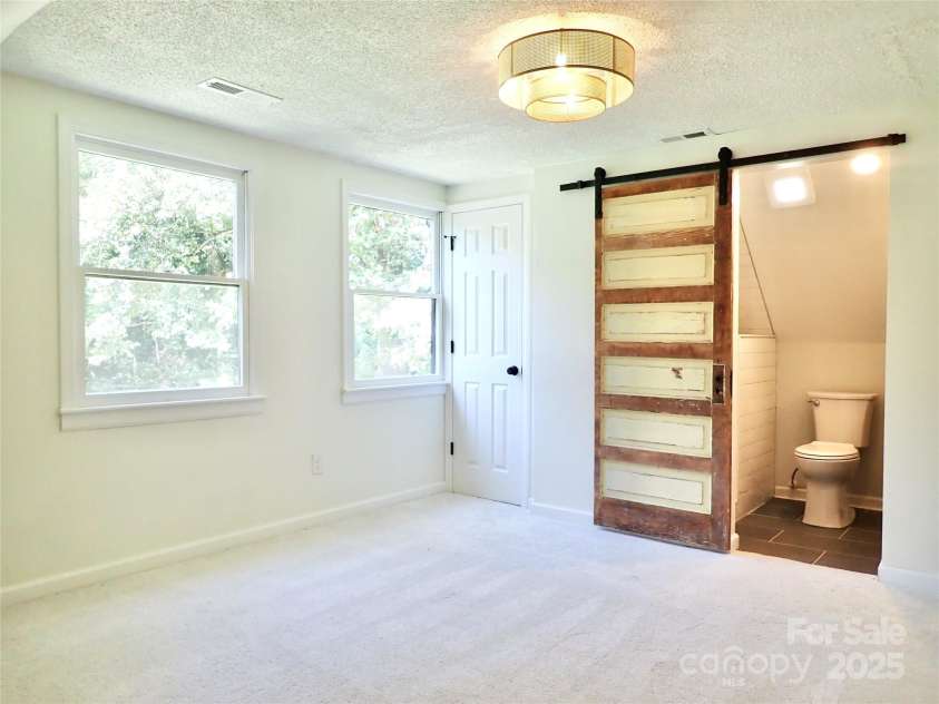 3921 Lake Road, Charlotte, NC 28269.  MLS# CAR4272697, YatesRealty ID 34981. Primary Bedroom with en suite