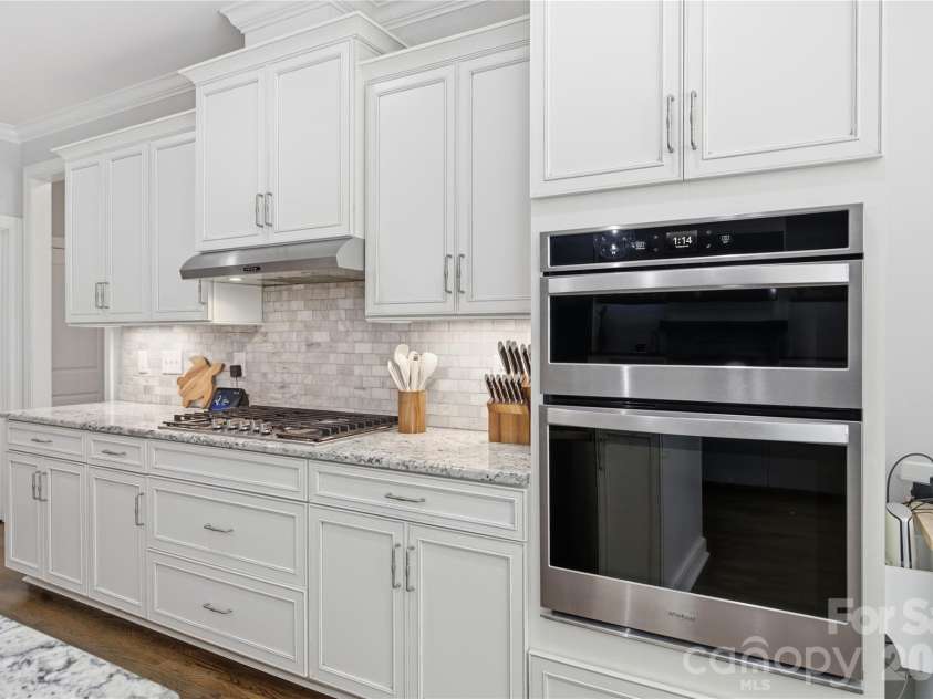 7478 Brotherton Road, Denver, NC 28037.  MLS# CAR4399336, YatesRealty ID 34984. Kitchen features gas cooktop and beautiful tile backsplash