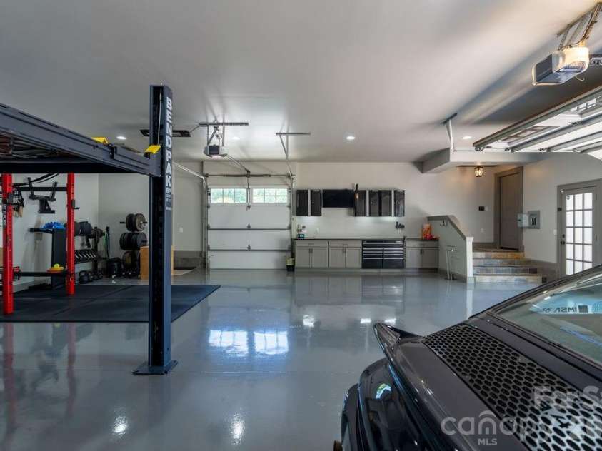 3335 Providence Road, Charlotte, NC 28211.  MLS# CAR4370866, YatesRealty ID 34988. Two overhead doors in garage for easy access and built-in tool storage/work shop