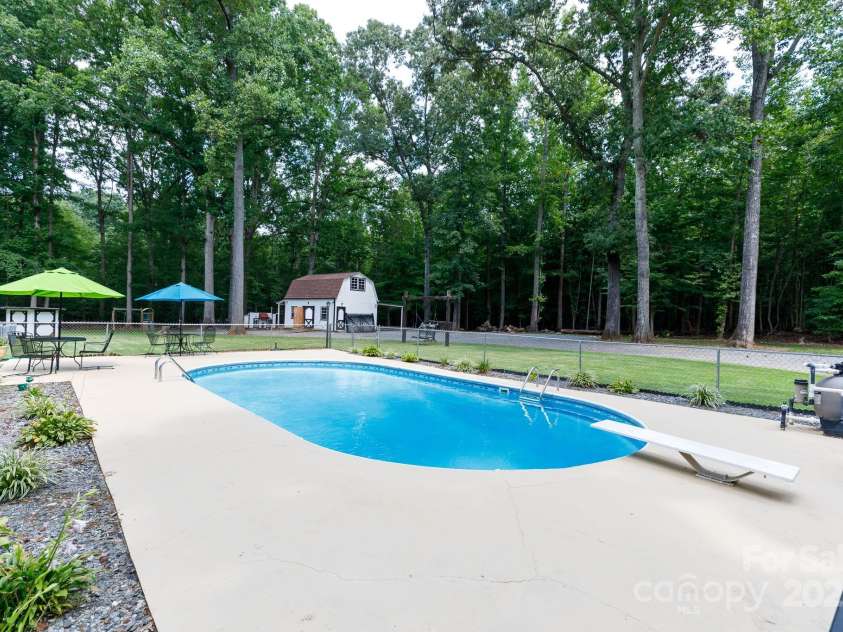 4520 Belhaven Forest Drive, Gastonia, NC 28056.  MLS# CAR4294728, YatesRealty ID 34993. In ground pool, patio sets stay along w equipment including a heated blanket