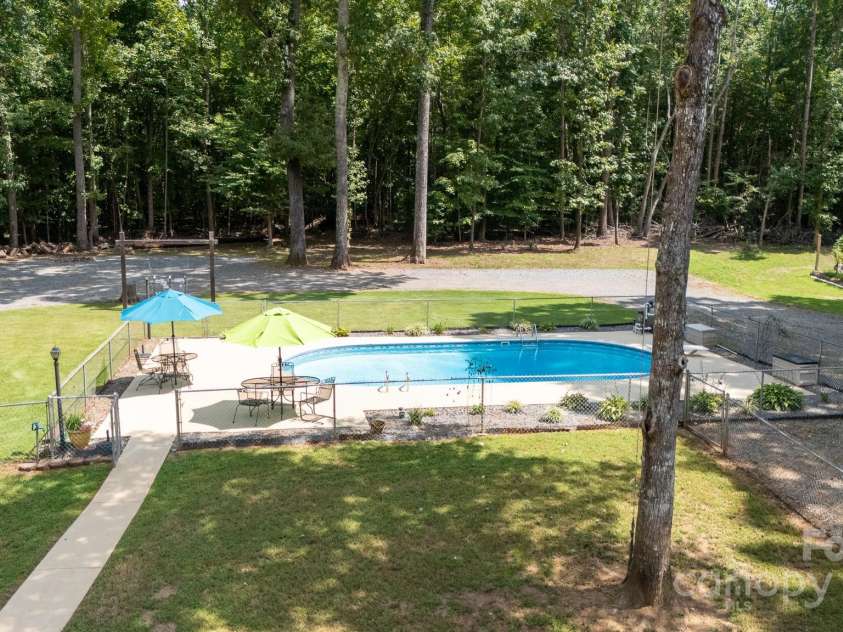 4520 Belhaven Forest Drive, Gastonia, NC 28056.  MLS# CAR4294728, YatesRealty ID 34993. Paved walkways help keep entertaining neat.