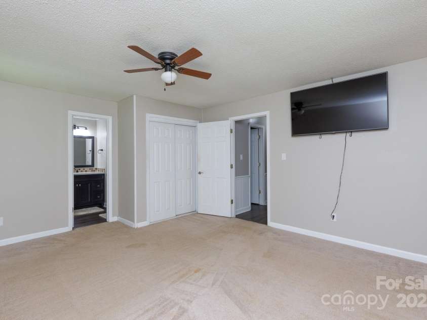 4520 Belhaven Forest Drive, Gastonia, NC 28056.  MLS# CAR4294728, YatesRealty ID 34993. Primary bedroom suite - TV to stay