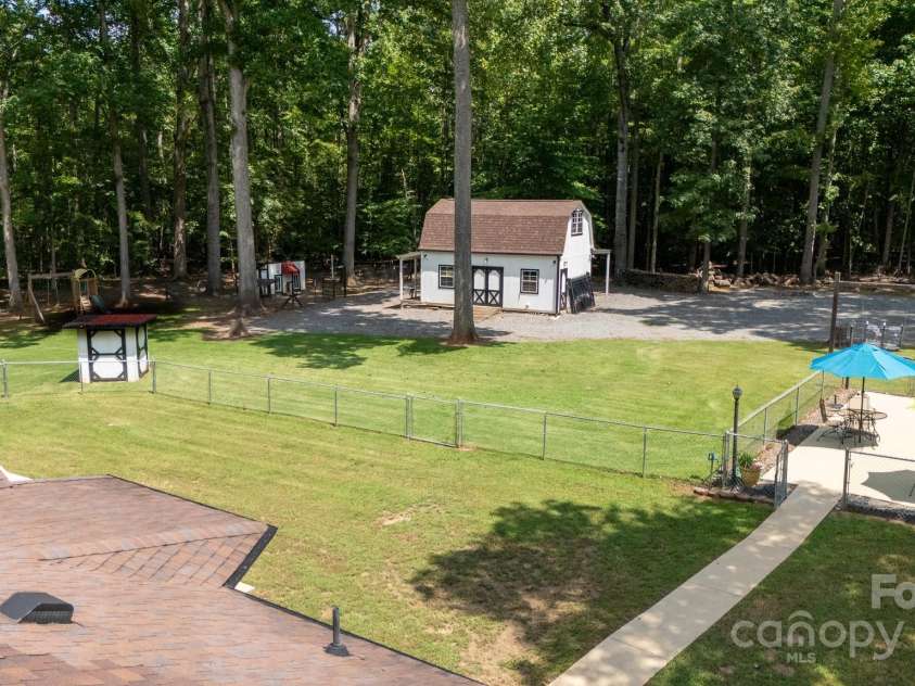 4520 Belhaven Forest Drive, Gastonia, NC 28056.  MLS# CAR4294728, YatesRealty ID 34993. Well house and chicken area is beside shed.