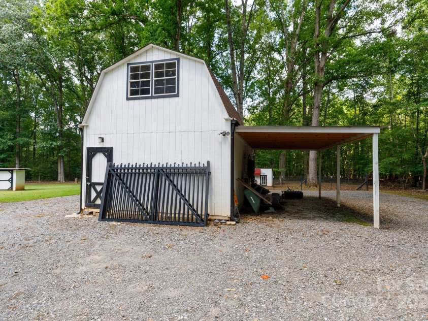 4520 Belhaven Forest Drive, Gastonia, NC 28056.  MLS# CAR4294728, YatesRealty ID 34993. Wired workshop w/ lean to