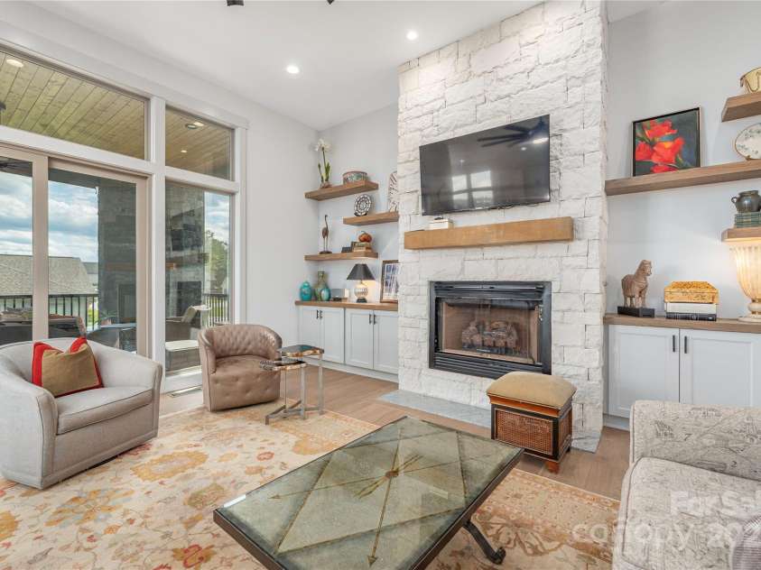 456 Samuel Drive, Mills River, NC 28759.  MLS# CAR4295311, YatesRealty ID 34995. Great Room Opens to The Screen In Porch