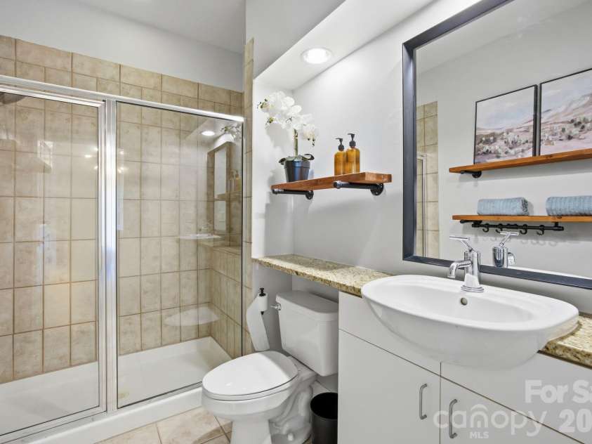 906 Garden District Drive, Charlotte, NC 28202.  MLS# CAR4391842, YatesRealty ID 34995. Primary suite bath/professionally cleaned grout and re-caulked shower