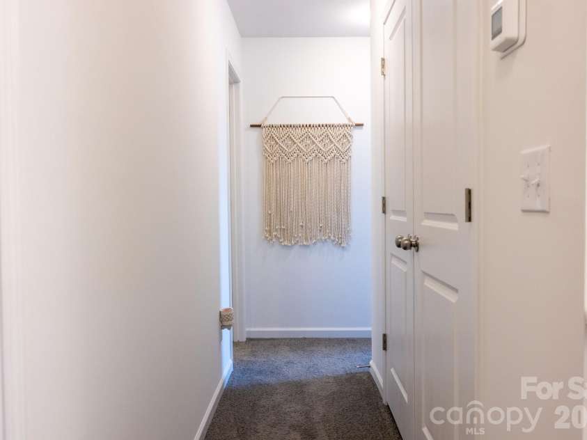 556 Willamette Drive, Salisbury, NC 28146.  MLS# CAR4399196, YatesRealty ID 34999. Second floor hallway with utility room on the right