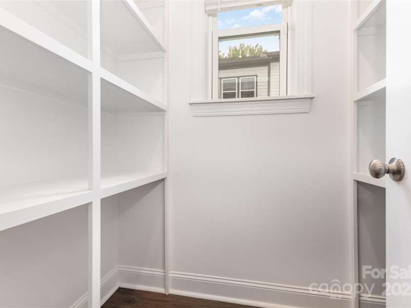 12313 Landry Renee Place, Charlotte, NC 28277.  MLS# CAR4294367, YatesRealty ID 35001. Walk-in pantry with wood shelving