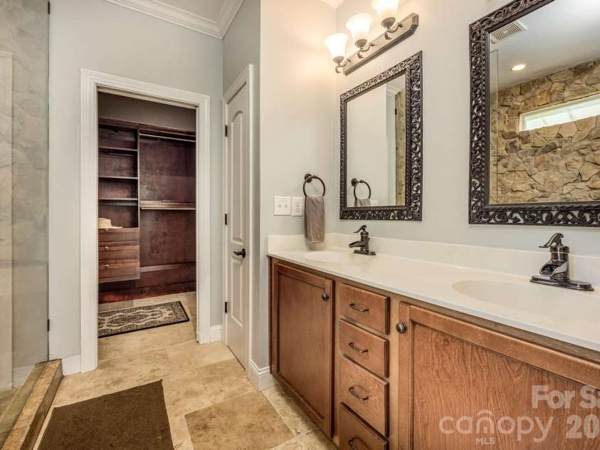 7933 Sally Clark Drive, Denver, NC 28037.  MLS# CAR4397836, YatesRealty ID 35007. Primary Bath w/beautiful natural stone shower
