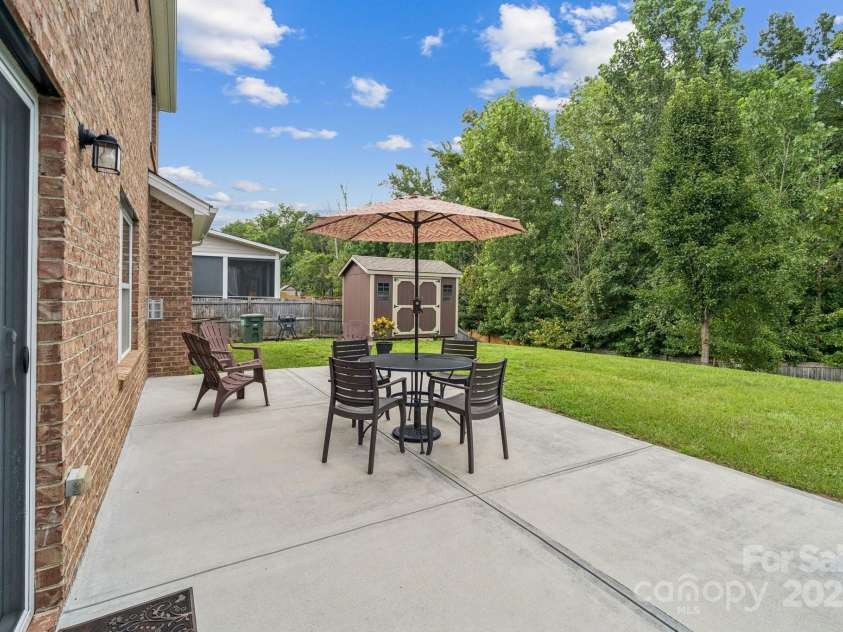 3922 Martele Drive, Mint Hill, NC 28227.  MLS# CAR4292629, YatesRealty ID 35015. Double Concrete Patio