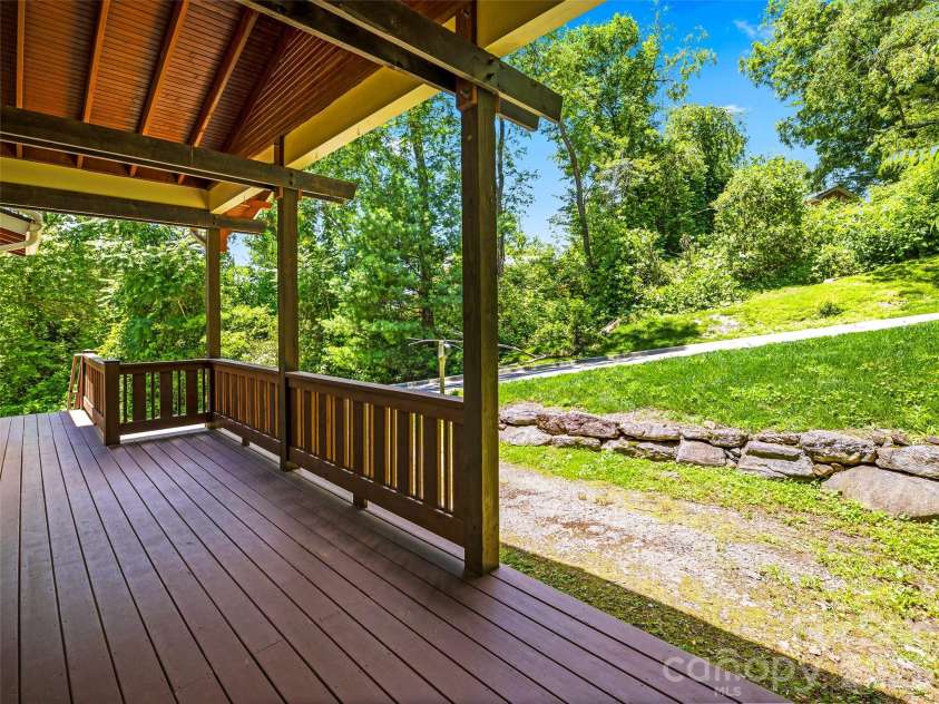 25 Shady Park Lane, Asheville, NC 28804.  MLS# CAR4395453, YatesRealty ID 35017. Expansive decking with vaulted ceilings.