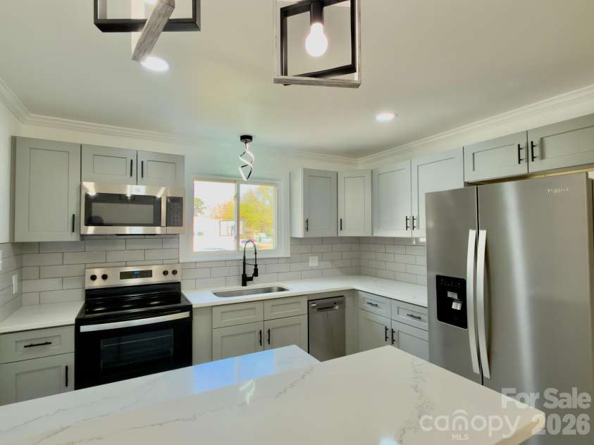 1033 Tracy Drive, Charlotte, NC 28217.  MLS# CAR4373895, YatesRealty ID 35024. Fully renovated kitchen