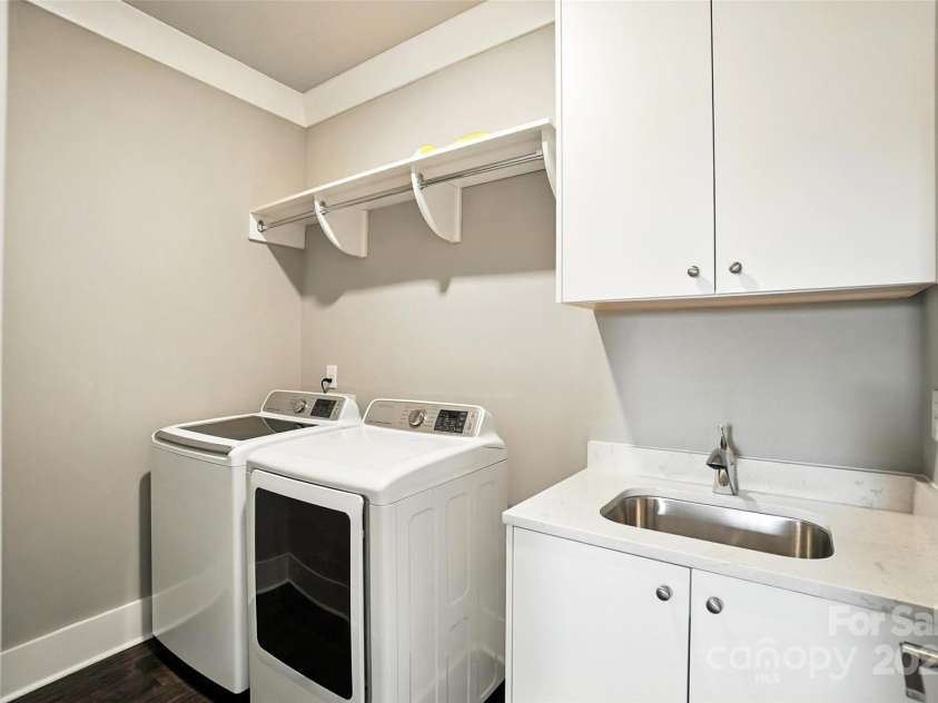 7903 Rea View Court, Charlotte, NC 28226.  MLS# CAR4284335, YatesRealty ID 35024. Laundry with sink upstairs