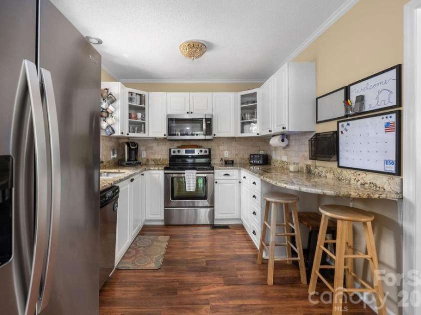 7734 Red Robin Trail, Denver, NC 28037.  MLS# CAR4398482, YatesRealty ID 35033. Kitchen with SS appliances (Refrigerator may convey with acceptable offer)