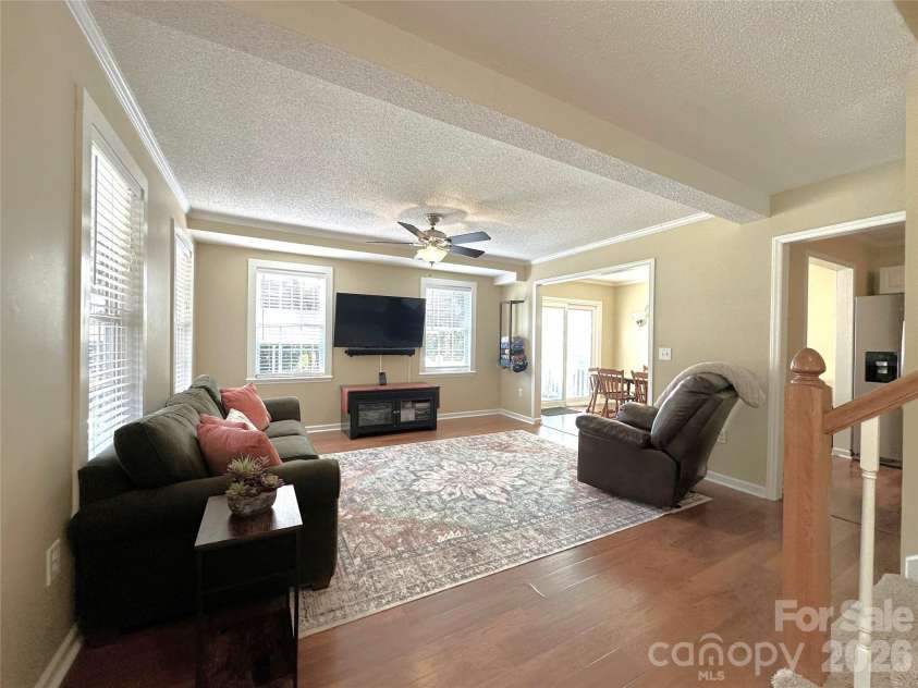 7734 Red Robin Trail, Denver, NC 28037.  MLS# CAR4398482, YatesRealty ID 35033. Living Room Open to Kitchen and Dining