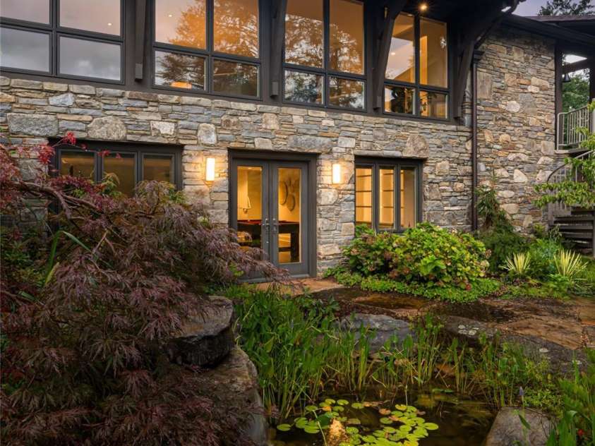 80 Kimberly Knoll Road, Asheville, NC 28804.  MLS# CAR4275443, YatesRealty ID 35034. Lower level exterior doors lead to stone patio and koi pond
