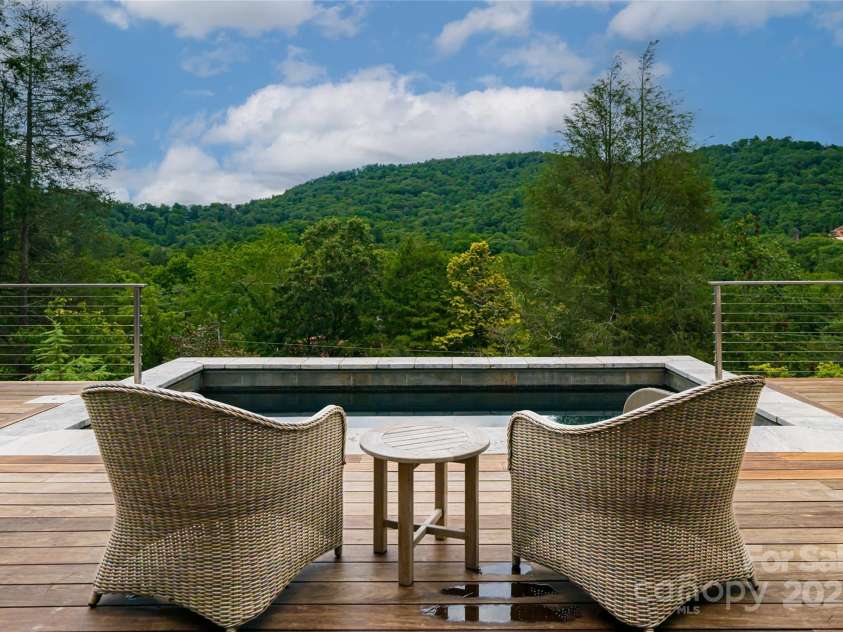 80 Kimberly Knoll Road, Asheville, NC 28804.  MLS# CAR4275443, YatesRealty ID 35034. Outdoor living space with views of Grove Park Inn