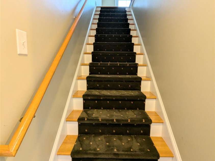 4416 Sages Avenue, Indian Trail, NC 28079.  MLS# CAR4293397, YatesRealty ID 35052. Wood tread stairs with runner