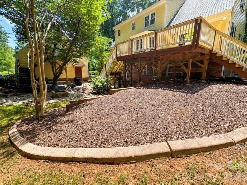 469 Augusta Drive, Statesville, NC 28625.  MLS# CAR4391486, YatesRealty ID 35053. Custom concrete edging on flower beds