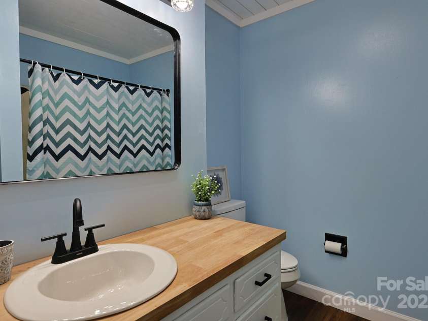 205 Dana Drive, Salisbury, NC 28147.  MLS# CAR4288780, YatesRealty ID 35059. Lvp flooring shiplap ceiling make this secondary bath perfect