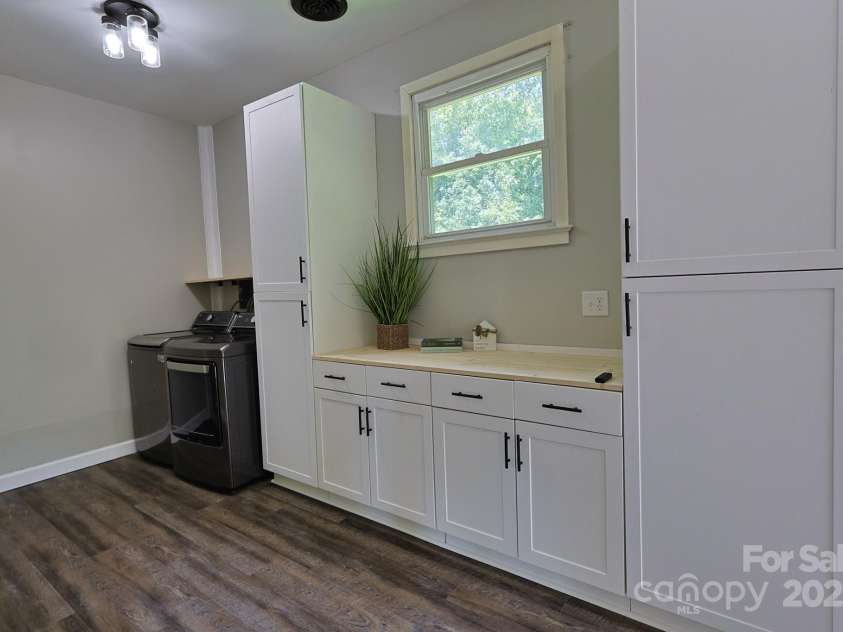 205 Dana Drive, Salisbury, NC 28147.  MLS# CAR4288780, YatesRealty ID 35059. Oversized laundry with lots of cabinets/storage and washer and dryer included