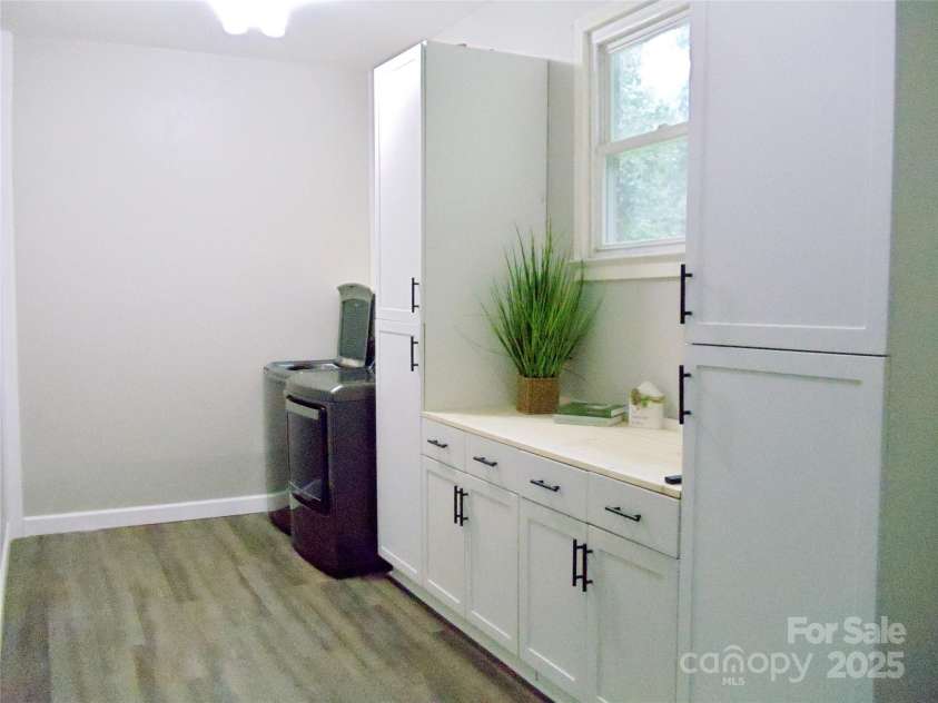 205 Dana Drive, Salisbury, NC 28147.  MLS# CAR4288780, YatesRealty ID 35059. This laundry room offers plenty of space and new cabinets with soft close feature!