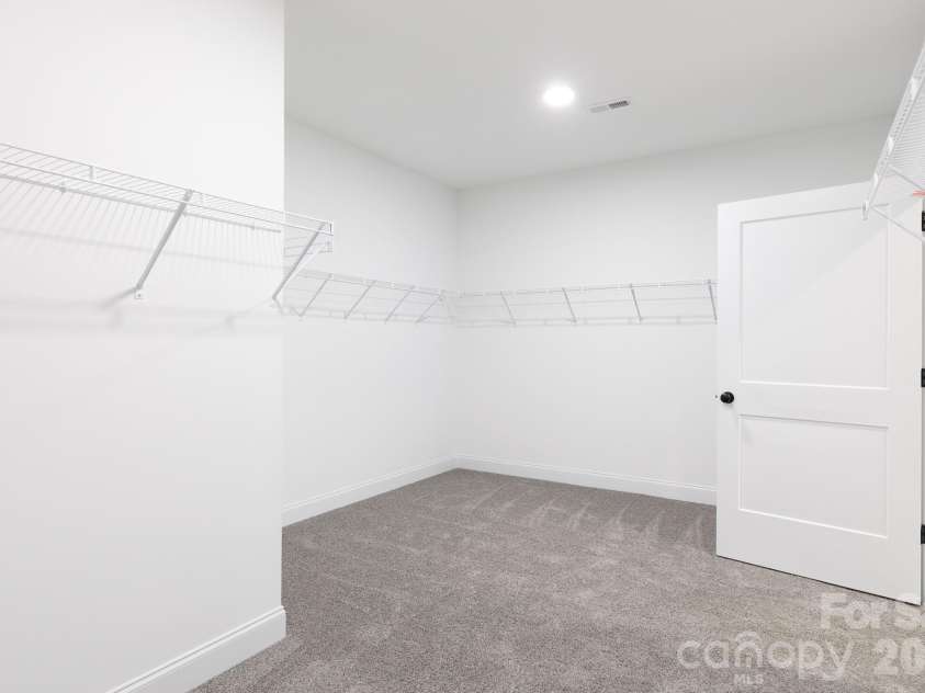 502 Squaw Lane, Edgemoor, SC 29712.  MLS# CAR4342690, YatesRealty ID 3506. Oversized primary closet with ample storage and clothing space.