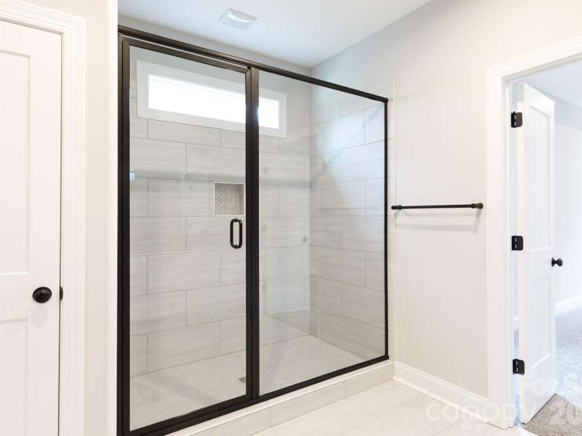 502 Squaw Lane, Edgemoor, SC 29712.  MLS# CAR4342690, YatesRealty ID 3506. Walk-in tiled shower in primary bath.