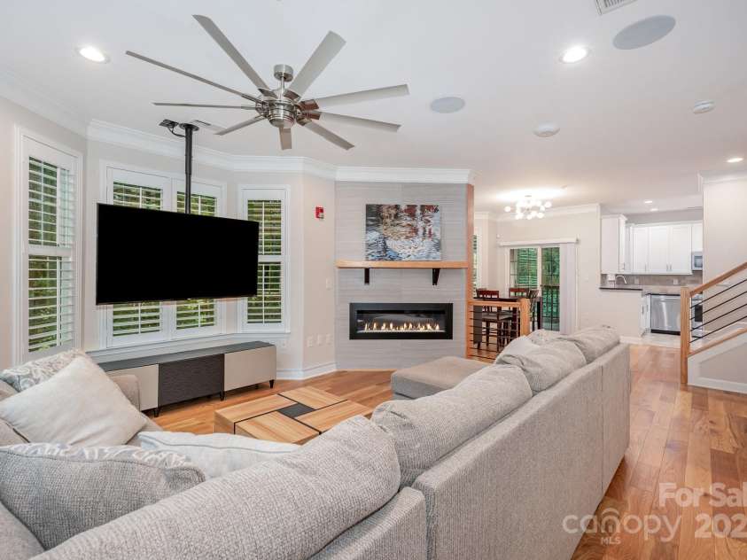 7103 Founders Club Court, Charlotte, NC 28269.  MLS# CAR4294615, YatesRealty ID 35061. Custom gas fireplace with wood mantle