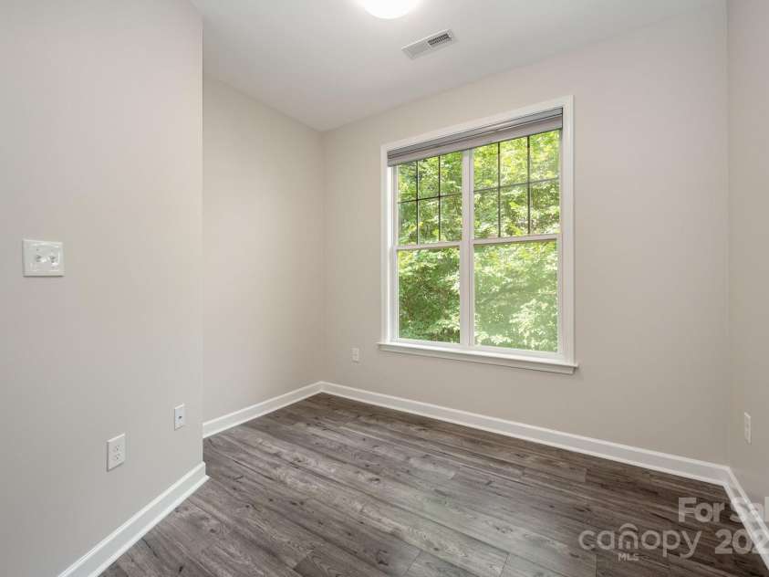 7103 Founders Club Court, Charlotte, NC 28269.  MLS# CAR4294615, YatesRealty ID 35061. Guest Bedroom 2 w/ new LVP flooring