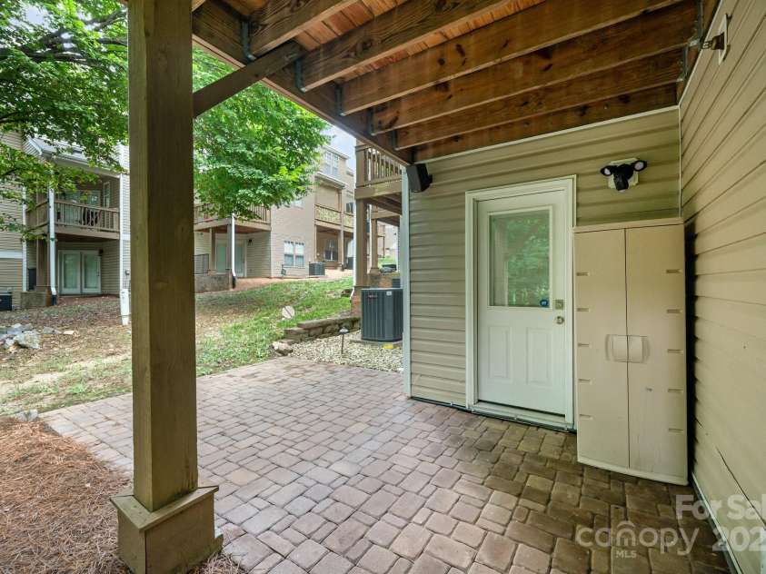 7103 Founders Club Court, Charlotte, NC 28269.  MLS# CAR4294615, YatesRealty ID 35061. Lower level extended back paver patio!