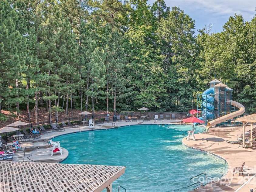 7103 Founders Club Court, Charlotte, NC 28269.  MLS# CAR4294615, YatesRealty ID 35061. Sports Club has waterslides and the fitness center!