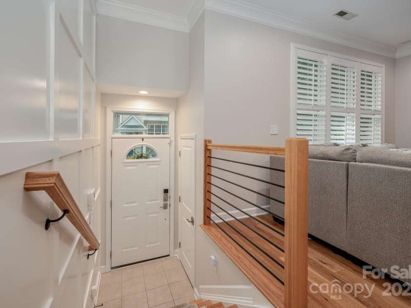 7103 Founders Club Court, Charlotte, NC 28269.  MLS# CAR4294615, YatesRealty ID 35061. Stunning judge paneling creates a feature wall from font door to lower level