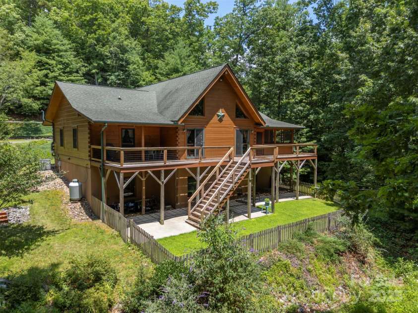 23 Jay Foster Way, Saluda, NC 28773.  MLS# CAR4278065, YatesRealty ID 35063. Enjoy peace and quiet in this Post & Beam log home with expansive outdoor living space to enjoy quiet evenings.  Ample space for entertaining guests!