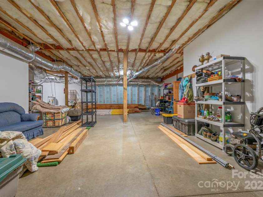 23 Jay Foster Way, Saluda, NC 28773.  MLS# CAR4278065, YatesRealty ID 35063. Full unfinished basement is insulated Superior Walls construction, (not cinder block).  Extra tall ceilings allow ample room for completed living space.