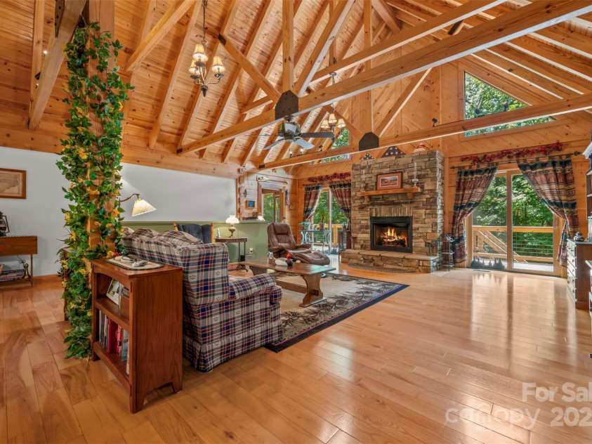 23 Jay Foster Way, Saluda, NC 28773.  MLS# CAR4278065, YatesRealty ID 35063. Impressive Cathedral ceiling with exposed trusses and tongue and groove pine ceiling.
