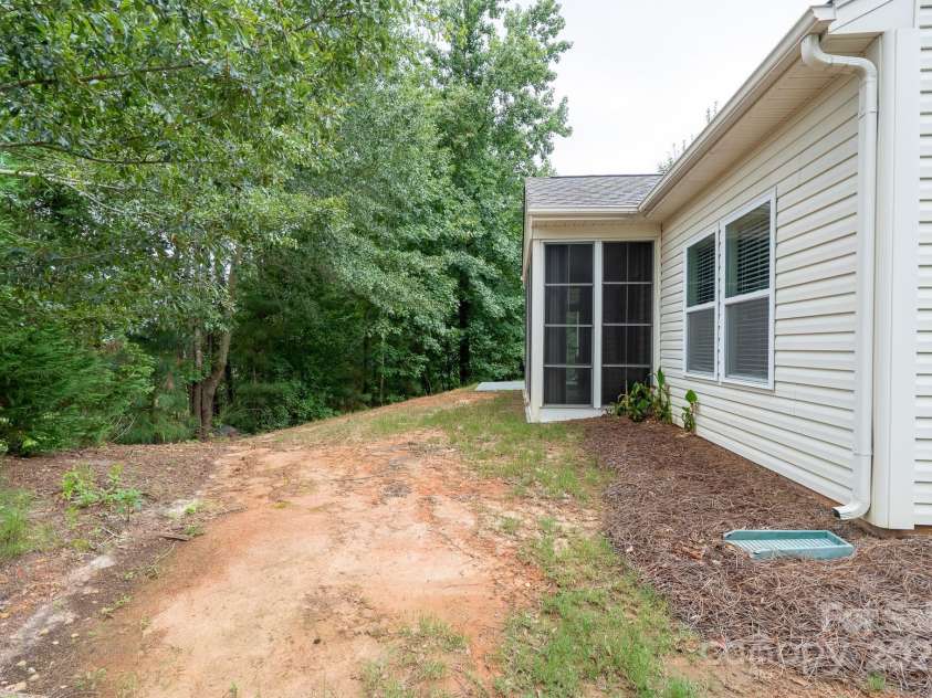2496 Bergamot Street, Tega Cay, SC 29708.  MLS# CAR4288569, YatesRealty ID 35064. Enclosed sunroom